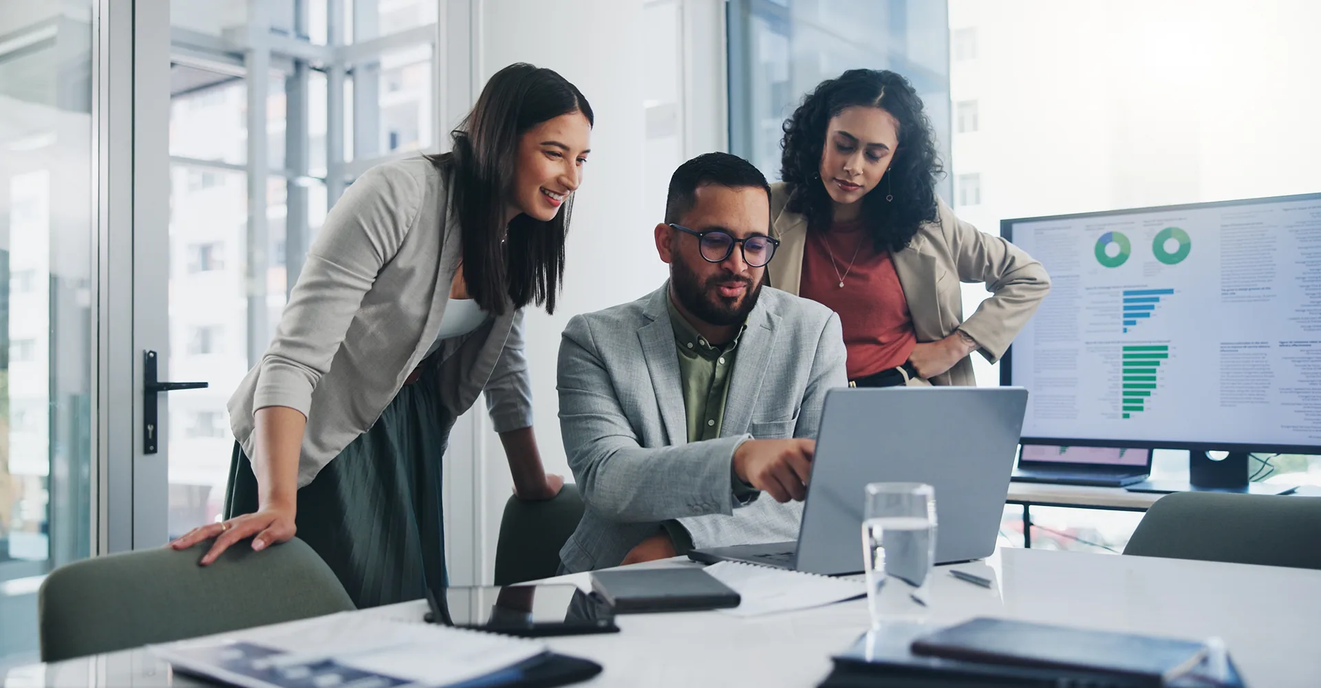 A finance team reviewing data together